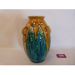 A Minton secessionist four handled ovoid vase, number 44; tube-line decorated in shades of blue,