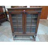 A 1920s oak glazed bookcase. 36' wide