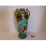 A Mintons ovoid two handled vase decorated in brightly coloured enamels with peafowl and foliage.