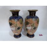 A pair of Royal Doulton Slater's Patent inverted baluster vases, decorated by Emily Partington