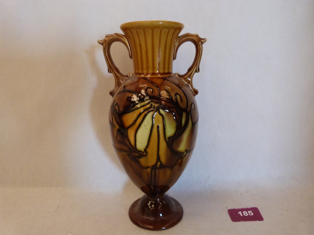 A Minton Secessionist two handled vase, number 22, tube-line decorated with stylised foliage on a