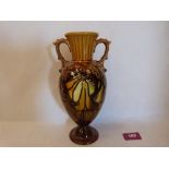 A Minton Secessionist two handled vase, number 22, tube-line decorated with stylised foliage on a