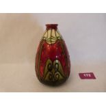 A Mintons Secessionist vase, number 30, of tapering conical form, tube-line decorated on a red and