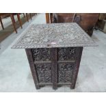 An Indian carved and pierced hardwood table. 24' wide