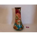A Mintons tapered vase, decorated in brightly coloured enamels with honesty leaves. Printed mark