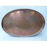 A Hugh Walker copper oval salver with gadrooned rim. Impressed monogram. c.1910. 22' long