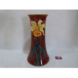 A Doulton Lambeth Faience tapered vase, decorated by Katherine Blake Smallfield with daffodils.