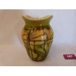 A Minton Secessionist vase, number 4, decorated with stylised foliage in shades of green, brown,