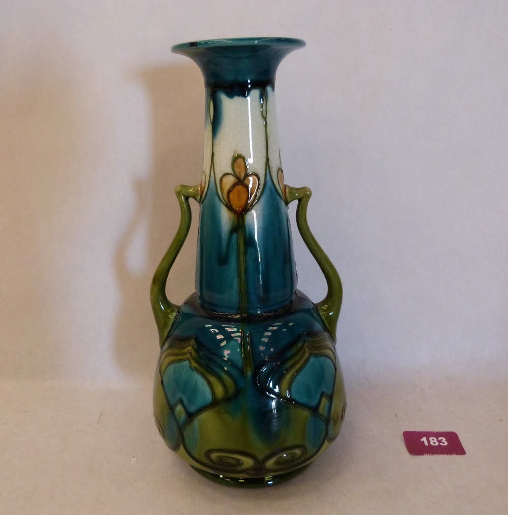 A Minton Secessionist two handled vase, number 8, tube-line decorated with stylised foliage on a