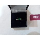 A 9ct emerald and diamond ring. 1.9g gross. Size Q