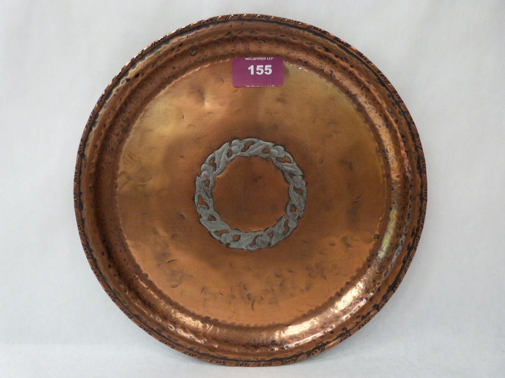 A Hugh Wallace planished copper and silvered dish, the centre with a ring of fruiting foliage.