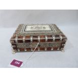 A Victorian Vizagapatam tortoiseshell and ivory mounted casket on paw feet. 8' wide