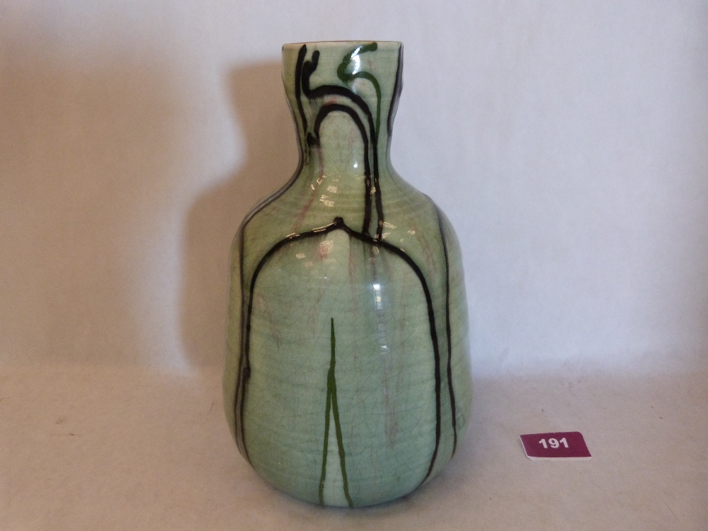 A Minton Secessionist vase, decorated with black and green lines on a green ground. Factory mark