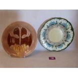 Two Minton majolica secessionist design plates, tube-line decorated with stylised foliage. Impressed