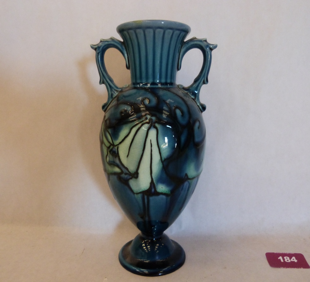 A Minton Secessionist two handled vase, number 23, tube-line decorated with stylised foliage on a