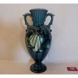 A Minton Secessionist two handled vase, number 23, tube-line decorated with stylised foliage on a