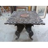 An oriental carved hardwood table. 23' wide