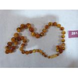 A necklace of graduated amber beads. 34.8g gross. 24' long