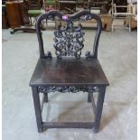 A late 19th century Chinese carved hardwood chair
