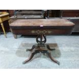 A Regency rosewood and brass inlaid card table on lyre support. 37' wide. (A.F.)