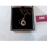 A 9ct oval citrine and white stone pendant on 9ct necklet chain. 3.5g gross