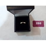 A 9ct solitaire diamond ring. Stone 0.1 - 0.12pts approx. 1.3g gross