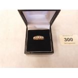 An Edwardian 18ct ring set with five opals. Size O½. 3.2g gross
