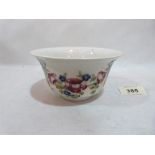 A William Moorcroft Macintyre bowl, decorated with a continuous garland of flowers and ribbon ties