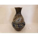 A Doulton Lambeth stoneware truncated vase decorated in shades of blue and green. Signed WP (William