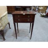 A Regency mahogany lady's writing/work table, the re-entrant top over two drawers, one fitted with a