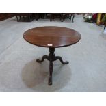 A 19th century mahogany dropleaf occasional table on tripod support. 25½' wide