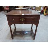 A 17th century joined oak side table, the moulded top over a frieze drawer on turned legs united