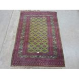 A green ground eastern rug. 72' x 50'