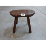 A 19th century oak milking stool. 9' high