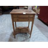 A mahogany side table with two drawers on square tapered legs united by an undertier. 18' wide