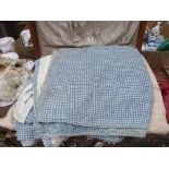 Three vintage quilts and other textiles in a vintage case