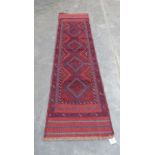 A Meshwani carpet runner. 2.46m x 0.64m