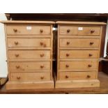 A pair of pine chests of five long drawers 25½' high