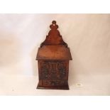 A George III treen salt box of exceptional colour, the front carved with a lyre and foliage with