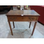 A George III oak side table with frieze drawer on square chamfered legs