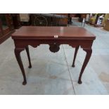 A Georgian mahogany card table with shell carved shaped frieze on cabriole legs. 35' wide