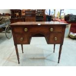 A Regency mahogany sideboard fitted with three drawers on turned tapered legs. 39' wide