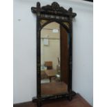 A Victorian 'aesthetic' design ebonised pier glass. 32' high