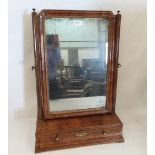 A Queen Anne walnut dressing table mirror with early bevelled plate, the inlaid base with