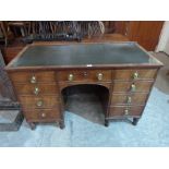 A 19th century mahogany kneehole desk with inlet top. 49' wide