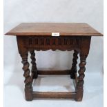 A 17th century oak joint stool on barleytwist turned splayed supports. 20' wide