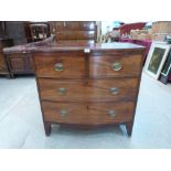 A George III mahogany bowfronted chest of two short over two long drawers, on splayed bracket