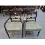 A set of four George IV mahogany dining chairs, the set to include a carver