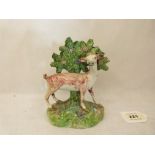 A Staffordshire figure of a sheep with tree behind. 19th century. 5½' high