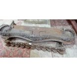 Two Victorian cast iron fenders